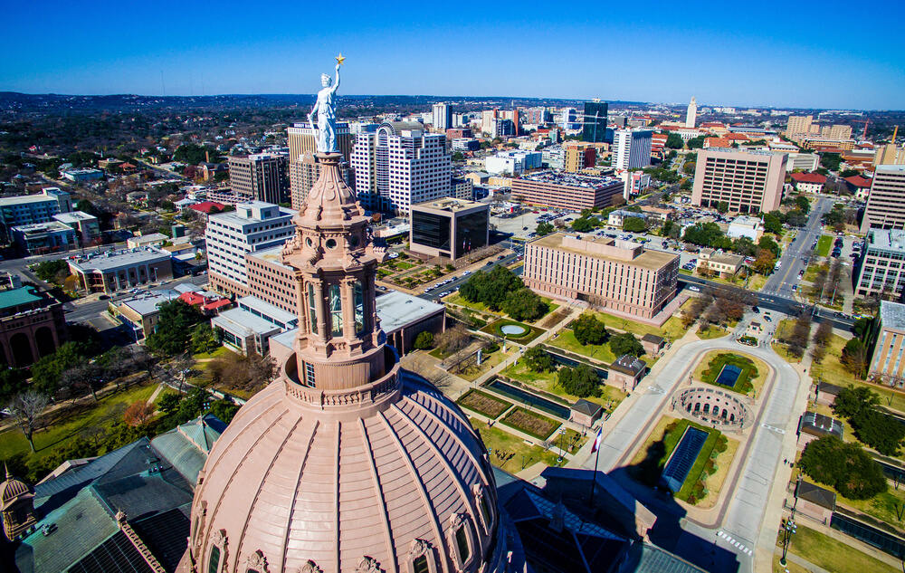 Arial view of Austin, Texas with the Texas state capital building in the forefront.